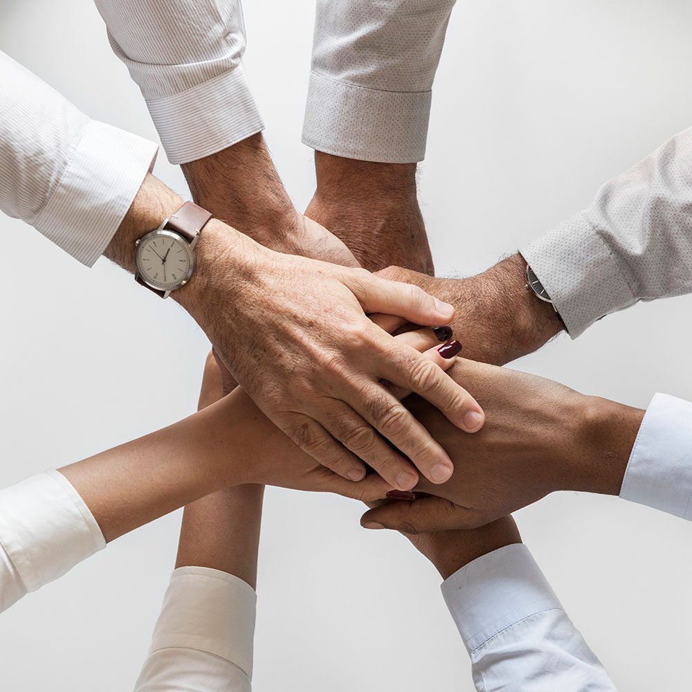 business-hands-joined-together-teamwork